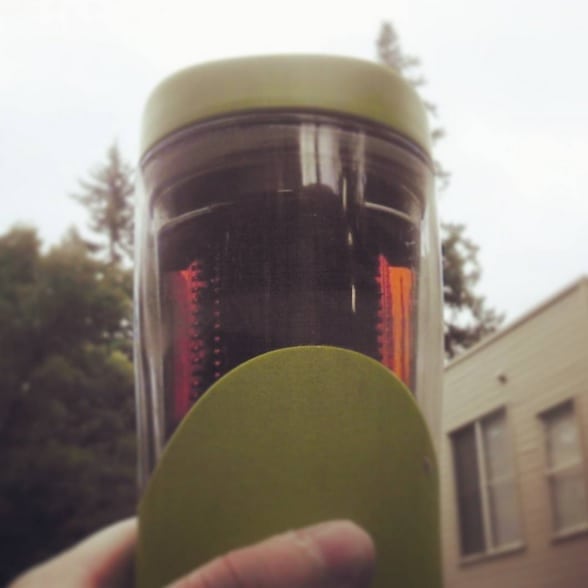 Doke in a travel mug